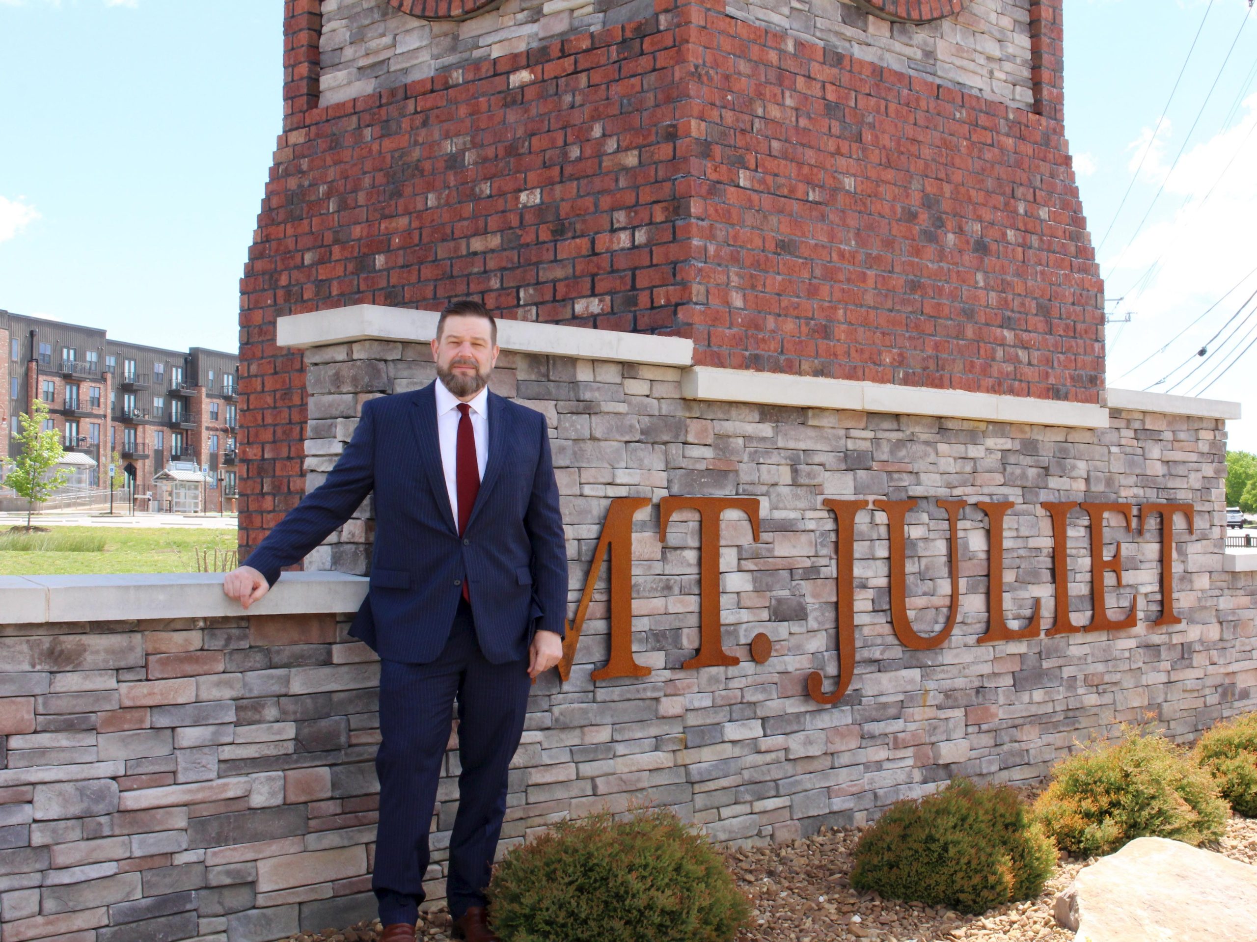 Ryan Rumfelt standing in front of the Mt Juliet clock tower